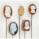 (Lot of 5) Onyx and lava cameo, gold, gold-filled stickpins Including (1) sardonyx cameo (signed