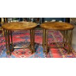 Pair of Louis XVI style side tables, each having an oval top, and rising on reeded circular legs,