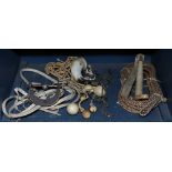 100One bin of Western horse tack, including a bridle, spurs, woven line, etc.; Provenance: