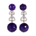 Pair of amethyst, diamond and 18k white gold earrings Featuring (4) round-cut amethysts, weighing