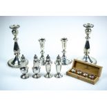 (lot of 12) Sterling silver weighted table articles, consisting of two pairs of candlesticks, two