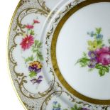 (lot of 9) Limoges porcelain dessert plates, each having a gilt rim with polychrome floral and