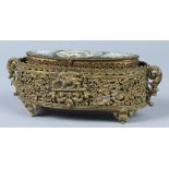 Victorian micro-mosaic brass vanity box, having an oval form, the hinged lid decorated with a