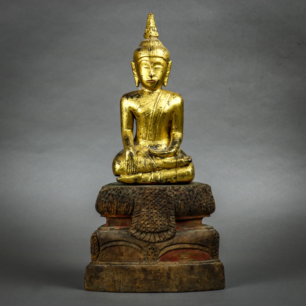 Southeast Asian gilt wood Buddha, seated in bhumispharsha mudra, on a tiered splayed pedestal, 13. - Image 2 of 4