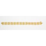 21k yellow gold bracelet Featuring (3) bead link bars, measuring approximately 11.0 mm in width,