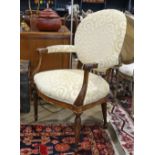 Transitional style armchair, the round upholstered back over the shaped seat, with fluted returns