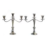 Pair of Gorham sterling silver weighted candlesticks, having swing arms, with (3) lights each,