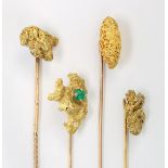 (Lot of 4) Emerald, yellow gold and metal stickpins Including (1) natural gold nugget and metal