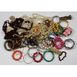 Collection of costume jewelry Including numerous bead and metal bracelets; 1) metal brooch; together