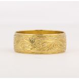 18k yellow gold band The engraved, 7.4 mm, 18k yellow gold band, (English Hallmarks, Birmingham,