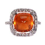 Garnet, diamond and 18k white gold ring Centering (1) pyramidal garnet cabochon, measuring