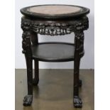 Chinese center table, having an inset marble top, 26"h x 19.5"dia.