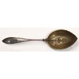 Gorham for Starr and Marcus sterling silver serving spoon, the bowl with gilt wash and a raised Lily