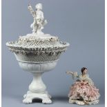 (lot of 2) Continental porcelain group, consisting of a lidded potpourri, having a putti finial over