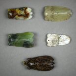 (lot of 5) Chinese hardstone toggles/plaques, four of stylized cicada form; the other of a blade