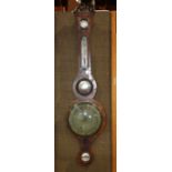 Federal style barometer, 19th Century, the carved wood case with bonnet top above the round brass