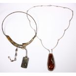 (Lot of 2) Amber and silver necklaces Including 1) Harold Perisco Paris, silver articulated