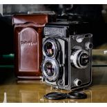 Rolleiflex camera, Synchro-Chromo, having a gray and black body, 75mm f= 3.5, lenses free of fungus