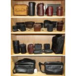 Four shelves of assorted Leitz/Leica camera and lens cases, consisting of both leather and nylon