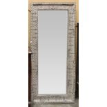 Victorian bevelled wall mirror, having a paint decorated metal border with wreath detail, 74"h x