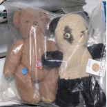 Vintage stuffed animal group, including a panda with radler, the other a brown bear with