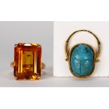 (Lot of 2) Synthetic sapphire, faience and yellow gold rings Including 1) synthetic orange