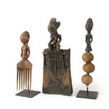 (lot of 3) African article group, consisting of a figural comb, rattle and thumb piano, in the style