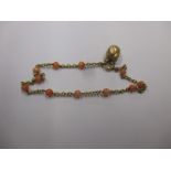 A 9ct gold and coral bracelet