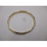 A 9ct gold bangle, approx. weight 8g