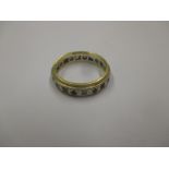 An 18ct gold and diamond eternity ring