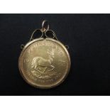 A 1975 Gold Krugerrand in mount