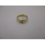 An 18ct gold ring set with a single diamond
