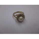 A 9ct gold diamond cluster ring with central cultured pearl