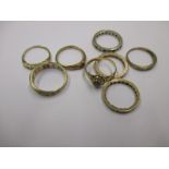 A quantity of gold and yellow metal rings, approx. weight 14g