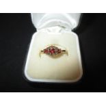 A vintage 9ct gold and garnet ring