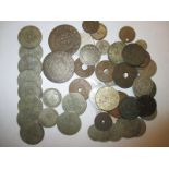 A quantity of mixed coins to include silver examples