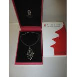 A Beijing Olympics commemorative necklace in original box