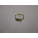 An 18ct gold 3 stone ring , one deficient