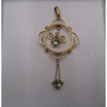 An Edwardian 9ct gold pendant set with 2 citrines and a seed pearl