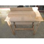 A late 19th century oak side table