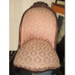 A 19th century upholstered carved frame parlour chair