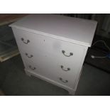 A painted chest of 3 long drawers