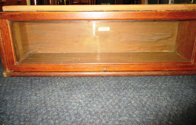 A single Globe Wernicke oak bookcase section