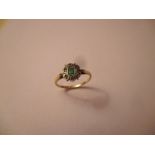 An Art Deco 9ct gold, diamond and emerald ring