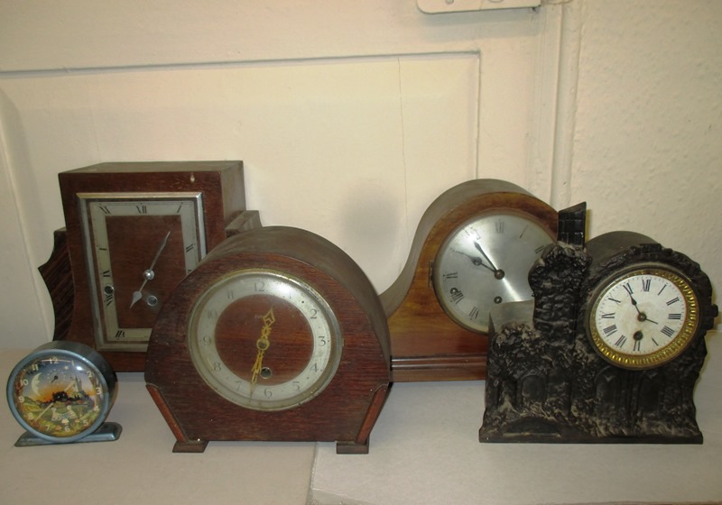 5 vintage clocks to include a continental iron cased example