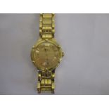 A Time Force Gold watch and strap marked 18k, approx total weight 72g