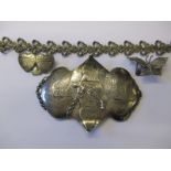 A small parcel of silver and white metal items to include a belt buckle showing trade routes