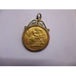 A 1910 gold half sovereign in 9ct pendant mount