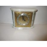 A vintage white marble cased mantle clock by Elliot retailed by Upchurch Colchester