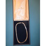 A white gold choker necklace marked 750, in original Mappin & Webb retailer’s box, approx. weight